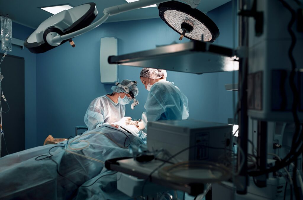 Operating room, surgeons make a complex ancological operation.